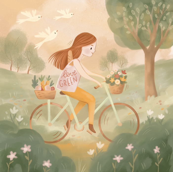 Girl riding on bicycle in the fields